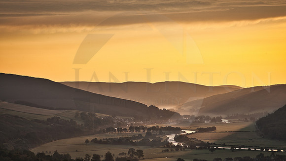 The view down the Tweed valley to Wakerburn at Sunrise